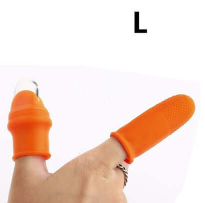 Silicone thumb knife protector finger guard in orange, providing safe cutting and preventing slips.