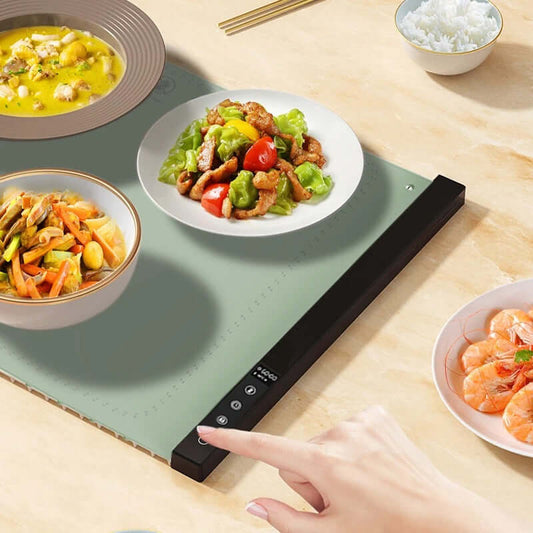 Foldable Food Insulation Board Heating Mat with plates of food on a table for keeping meals warm.