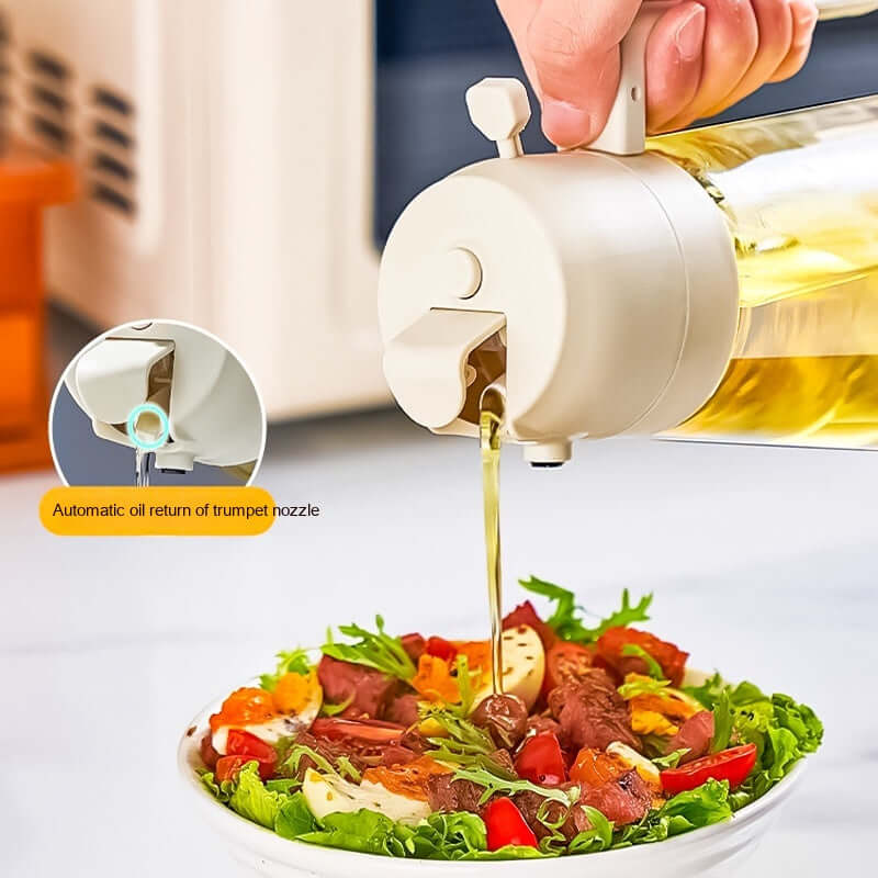 Handheld olive oil sprayer dispenser spraying oil on salad