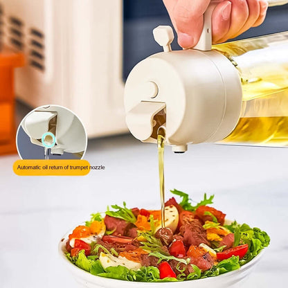 Handheld olive oil sprayer dispenser spraying oil on salad